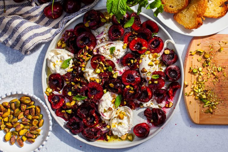 burrata with crushed cherries and pistachios